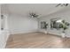 Spacious living room featuring plank flooring, neutral walls, and ample natural light at 9326 E Princess Dr, Mesa, AZ 85207