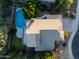 Aerial view of the house showcasing backyard pool, desert landscaping and neutral-toned roof at 9571 E Nittany Dr, Scottsdale, AZ 85255
