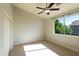 Bright bedroom offers neutral colors, a large window, and a closet at 9571 E Nittany Dr, Scottsdale, AZ 85255
