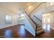 Bright entryway showcasing hardwood floors, staircase, large windows, and modern chandelier at 9571 E Nittany Dr, Scottsdale, AZ 85255