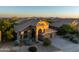 Stunning exterior elevation with desert landscaping and mountain views at 9571 E Nittany Dr, Scottsdale, AZ 85255