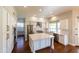 Bright kitchen features stainless steel appliances, an island, and white cabinets at 9571 E Nittany Dr, Scottsdale, AZ 85255