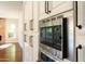 Built in stainless appliances are surrounded by ample white cabinets in the kitchen at 9571 E Nittany Dr, Scottsdale, AZ 85255