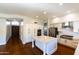 Spacious kitchen featuring a center island, stainless steel appliances, and white cabinetry at 9571 E Nittany Dr, Scottsdale, AZ 85255