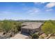 An aerial shot showcasing the tile roof and desert landscaping of this charming home at 11008 N 119Th Pl, Scottsdale, AZ 85259