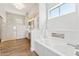 Bright bathroom with walk-in shower, soaking tub, and modern fixtures at 11008 N 119Th Pl, Scottsdale, AZ 85259