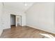 Bright bedroom features hardwood floors, ceiling fan, and an ensuite bathroom at 11008 N 119Th Pl, Scottsdale, AZ 85259
