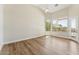 Spacious bedroom with hardwood floors, high ceilings, a ceiling fan, and large windows with a view at 11008 N 119Th Pl, Scottsdale, AZ 85259