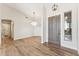Bright foyer with hardwood floors, modern lighting, and a front door with sidelight window at 11008 N 119Th Pl, Scottsdale, AZ 85259