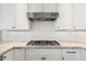 This kitchen features stone countertops, tile backsplash, and stainless steel hood at 11008 N 119Th Pl, Scottsdale, AZ 85259
