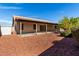 Home featuring a landscaped backyard and covered patio at 11065 W Runion Dr, Peoria, AZ 85373