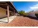 Landscaped backyard with covered patio at 11065 W Runion Dr, Peoria, AZ 85373