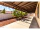 Covered patio area looks out to the landscaped backyard at 11065 W Runion Dr, Peoria, AZ 85373