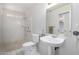 Well-lit bathroom featuring a walk-in shower and pedestal sink at 11065 W Runion Dr, Peoria, AZ 85373