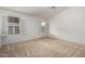 Bedroom featuring carpet flooring and natural light through open shutters at 11065 W Runion Dr, Peoria, AZ 85373