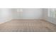 This cozy bedroom features neutral carpet, white walls, and two windows at 11065 W Runion Dr, Peoria, AZ 85373