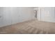Bright, neutral-colored bedroom with beige carpet and double closets at 11065 W Runion Dr, Peoria, AZ 85373