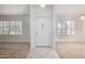 Front door with decorative glass insert, sidelight windows, and tiled floor at 11065 W Runion Dr, Peoria, AZ 85373