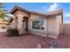 Attractive home with desert landscaping, arched entry, and tiled roof, showcasing curb appeal at 11065 W Runion Dr, Peoria, AZ 85373