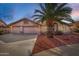Charming single-story home with a well-manicured front yard and a three-car garage at 11065 W Runion Dr, Peoria, AZ 85373