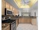 Updated kitchen with granite countertops and stainless steel appliances at 11065 W Runion Dr, Peoria, AZ 85373