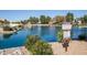 Picturesque view of Lake Ventana with community guidelines signage for residents at 11065 W Runion Dr, Peoria, AZ 85373