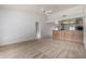 Spacious living room with a ceiling fan and view of the kitchen at 11065 W Runion Dr, Peoria, AZ 85373