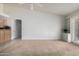 Living room with built-in cabinets and sliding door to patio at 11065 W Runion Dr, Peoria, AZ 85373