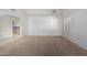 Expansive living space with arched doorway and neutral walls and flooring at 11065 W Runion Dr, Peoria, AZ 85373