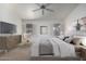 Comfortable main bedroom featuring soft, natural light, neutral color palette, and simple decor at 11065 W Runion Dr, Peoria, AZ 85373