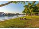 Relaxing park area with benches, lush lawns, and a tranquil view of the lake at 11065 W Runion Dr, Peoria, AZ 85373