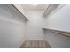 Walk-in closet featuring neutral carpet, white walls, and shelf and rail storage at 11065 W Runion Dr, Peoria, AZ 85373