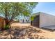 The backyard, with a view of the shed, home, and a tree in front at 1118 N 18Th St, Phoenix, AZ 85006