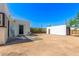 A full shot of the backyard featuring a shed and security doors at 1118 N 18Th St, Phoenix, AZ 85006