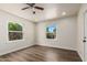 A bedroom featuring two windows for lots of natural light and wood-look flooring at 1118 N 18Th St, Phoenix, AZ 85006