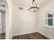 Bright dining room featuring new light-colored walls, wood floors, and modern light fixture at 1118 N 18Th St, Phoenix, AZ 85006