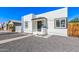 Charming white home featuring a black door, black trimmed windows, and desert landscaping at 1118 N 18Th St, Phoenix, AZ 85006