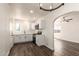 Bright kitchen with white cabinets, stainless steel appliances, and dark wood-look flooring at 1118 N 18Th St, Phoenix, AZ 85006