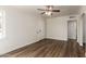 Bright living room featuring new light-colored walls, wood floors, and a rear entry door at 1118 N 18Th St, Phoenix, AZ 85006