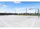 Outdoor basketball court with hoops and ample playing space at 11951 W Wier Ave, Avondale, AZ 85323