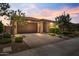 Charming single-story home with a two-car garage and well-maintained landscaping at 11951 W Wier Ave, Avondale, AZ 85323