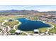 Scenic view of a community pond with walking paths and open green space at 11951 W Wier Ave, Avondale, AZ 85323
