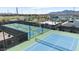Community tennis courts with multiple playing surfaces at 11951 W Wier Ave, Avondale, AZ 85323
