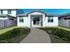 Cozy backyard with a small covered patio and green lawn, providing a private outdoor space at 12550 W Luxton Ln, Avondale, AZ 85323