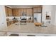 Spacious kitchen with stainless steel appliances, granite countertops, and ample cabinet space for storage at 12550 W Luxton Ln, Avondale, AZ 85323