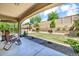 View of backyard patio with seating, barbeque, and well maintained desert landscaping at 12932 W Cassia Trl, Peoria, AZ 85383