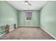 Cozy bedroom with carpet flooring, a ceiling fan, and a large window, creating a welcoming atmosphere at 12932 W Cassia Trl, Peoria, AZ 85383