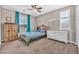 Comfortable bedroom with ample natural light, featuring a unique bed, wooden storage, and a white dresser at 12932 W Cassia Trl, Peoria, AZ 85383