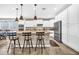 Stylish kitchen with a center island, stainless steel appliances, and white cabinets at 12932 W Cassia Trl, Peoria, AZ 85383