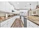 Bright kitchen with granite countertops, stainless steel appliances, and designer backsplash at 12932 W Cassia Trl, Peoria, AZ 85383